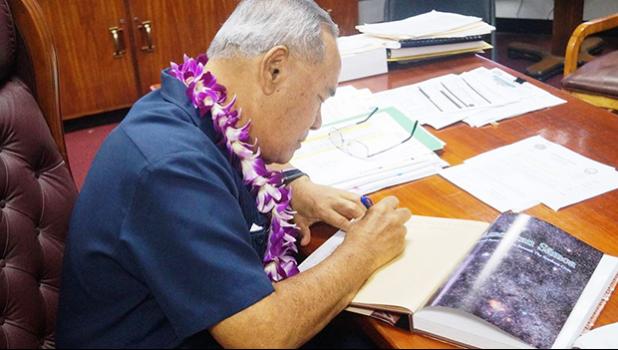Governor signs new edition of Centennial Book 