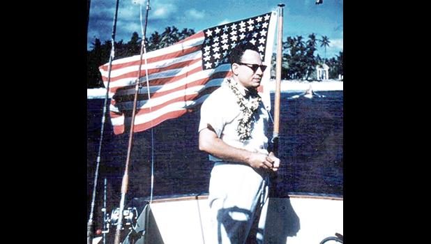 Gov. Tali Peter T. Coleman with a 48-star U.S. flag 