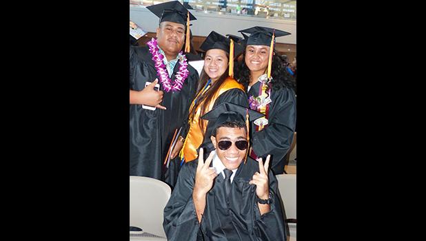 Posing for a Samoa News photo after the graduation ceremony, are some of the graduates at the American Samoa Community College’s Spring 2018 graduation ceremony last Friday at the ASCC Multi Purpose Center Auditorium. [photo: Leua Aiono Frost]