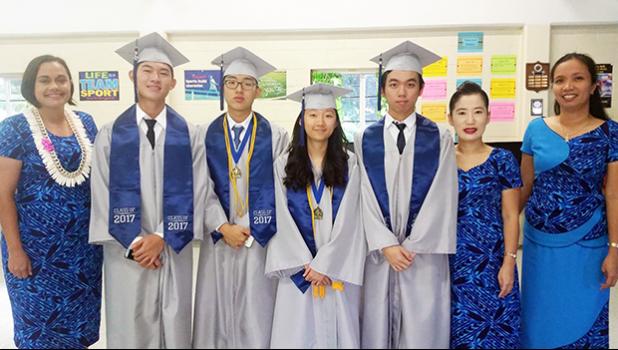 The Class of 2017 of Manumalo Academy High School with principal Tiana Trepanier (far left) and faculty members Seongshim Park and Miriam Mirasol (far right). The four graduates were all recipients of the congressional award and all of them will be continuing their education at off island colleges and universities. This is the first high school graduating class for the Flames since 2013. [photo: Blue Chen-Fruean]