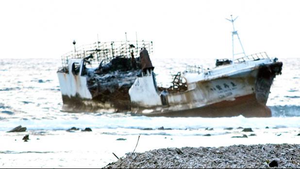 This photo taken Tuesday and provided by a local resident to Samoa News, shows the fishing vessel, Chui Zai Fa No. 1 just off the Leone village coast line.  The vessel has caused concern to local residents, who have noted a possible oil spill and damage to the reef, especially in the last two days of rough tides and strong winds. Samoa News understands some villagers have also complained of a ‘smell’ in the air, since the vessel showed up on their reef.  The US Coast Guard is sending a team from Hawai’i and
