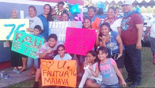 Samoana HS #76 Fautua Tufue Maiava Jr. is surrounded by family members and friends following his final game as a Shark this past season. The Fagasa native is the first Samoan player to be directly recruited from American Samoa, by Colorado Mesa University. See story for full details.  [photo: BC]