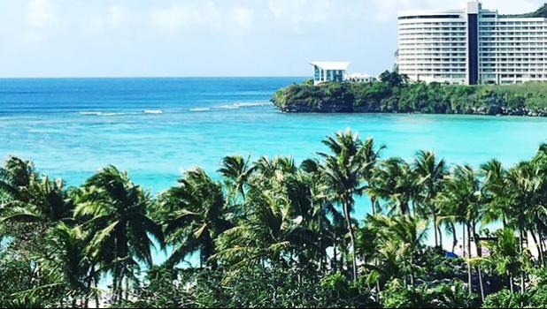 Photo of large hotel building in the distance in Guam