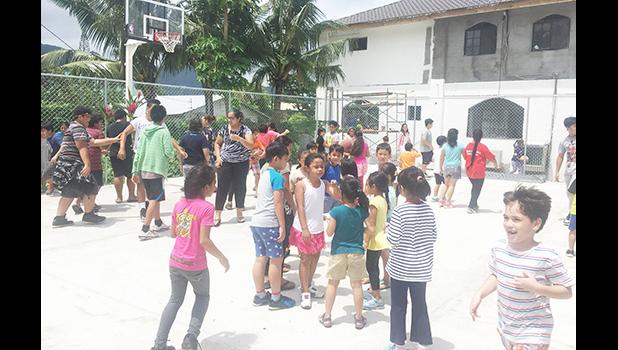 Pacific Horizons School’s Student Body occupies and celebrates their new half court that was officially opened last week Thursday, after a ribbon cutting ceremony that included thanks to the people who helped make the school a better place. See story and more photos inside. [Courtesy photo]