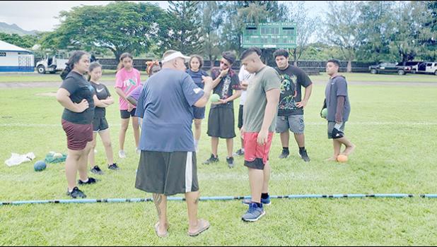 Coach CJ Sagapolutele Floor instructing Pacific Horizons School students