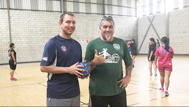 American Samoa Handball Association (ASHA) president and head coach Carl Floor Sr., and ASBA coach Michael Marsik with American Samoa’s U20 Women’s Handball Team practicing in the background