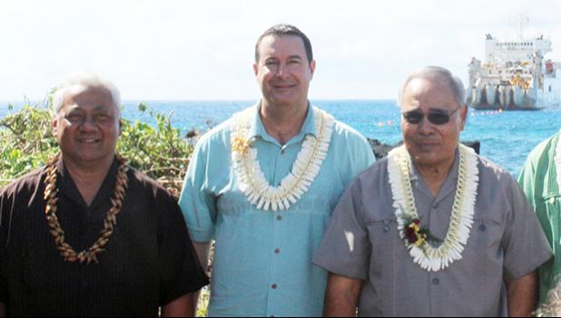 [l-r] ASTCA board chairman Sen. Fai’ivae Iuli Godinet; Hawaiki chief executive officer  Remi Galasso, and Gov. Lolo Matalasi Moliga, on the rocky-shoreline of Fogagogo last Saturday, while the vessel, Responder, anchors off on the ocean, laying the Hawaiki undersea fiber optic cable. [photo: Fili Sagapolutele]