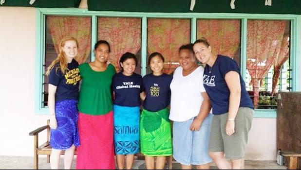 Nicola  Hawley and her former student Courtney Choy with others