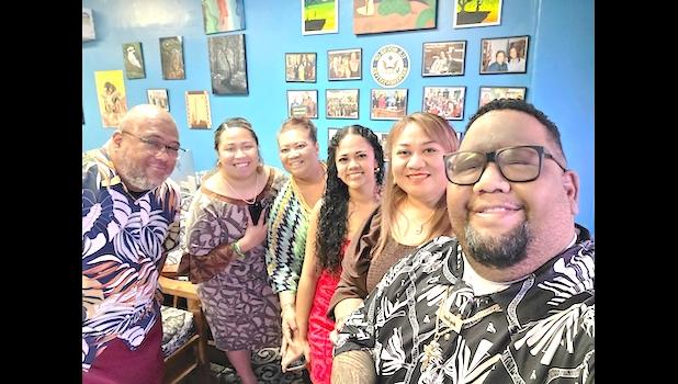 Haylie-Jeanette Tuiaoopo, center with office staff
