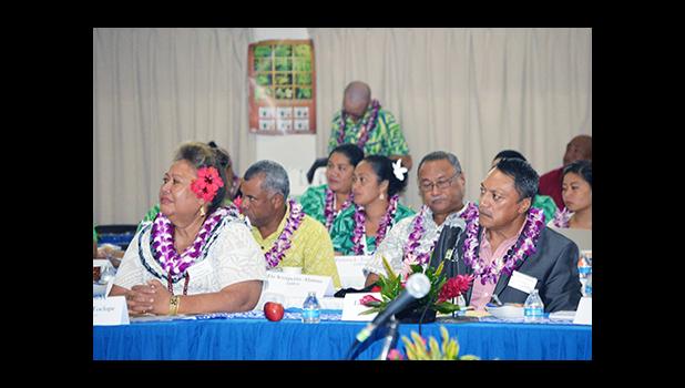 Samoa’s National Health Services General Manager Tupuimatagi Palanitina Toelupe (left) and Pastor Leonard Solomona, Founder of First-Touch Ministry Boot Camp of Samoa, along with members of the Samoa delegation (in the background) at yesterday’s opening of the three-day 7th Bilateral Health Summit of the two Samoas hosted by American Samoa at the Gov. H. Rex Lee Auditorium.  [photo: AF]