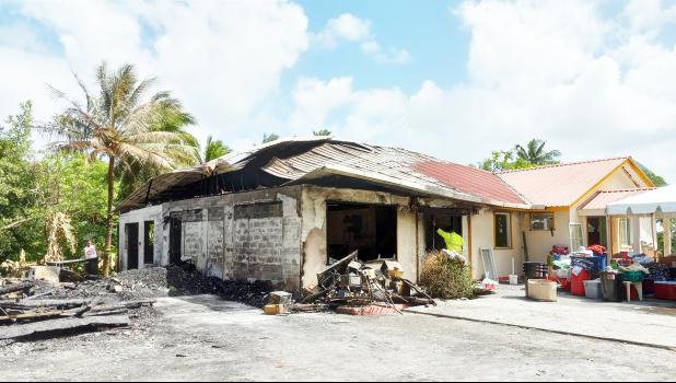 Partially burned home in Nuuuli