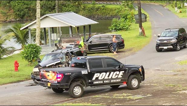 Wrecked truck involved in traffic accident with police cars