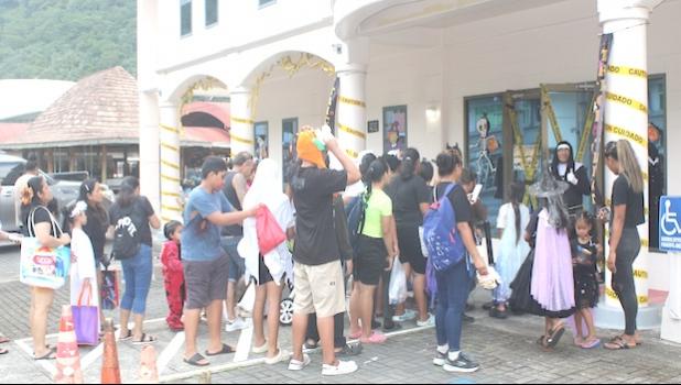 Halloween tricksters lined up outside the Jean P. Haydon Museum 