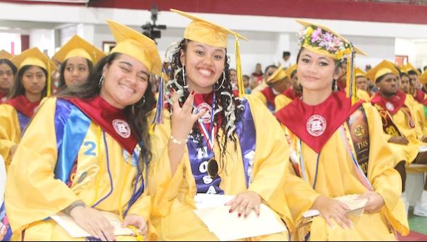 Rose Fiame (right) and Aooatua Fanene (center), along with Salutatorian Alexis Tuiasosopo (left)