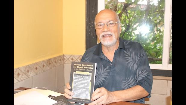Author Fuimaono Fini Aitaoto holds a copy of his new book