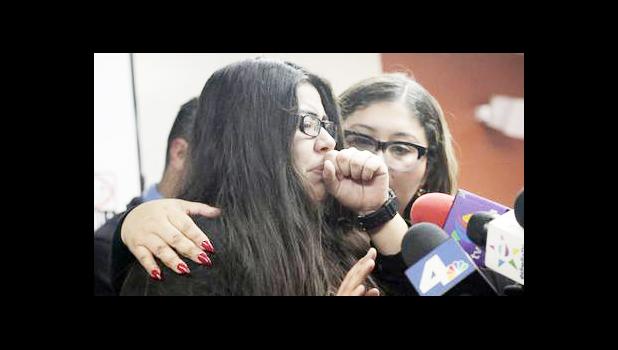 Marlene Mosqueda, left, who's father was arrested by ICE early Friday morning to be deported, is comforted at a news conference by her attorney Karla Navarrette at The Coalition for Humane Immigrant Rights of Los Angeles (CHIRLA) on Friday, Feb. 10, 2017. Navarrete, said she sought to stop Mosqueda from being placed on a bus to Mexico and was told by ICE that things had changed. She said another lawyer filed federal court papers to halt his removal. (AP Photo/Nick Ut) Marlene Mosqueda, left, who's father was arrested by ICE early Friday morning to be deported, is comforted at a news conference by her attorney Karla Navarrette at The Coalition for Humane Immigrant Rights of Los Angeles (CHIRLA) on Friday, Feb. 10, 2017. Navarrete, said she sought to stop Mosqueda from being placed on a bus to Mexico and was told by ICE that things had changed. She said another lawyer filed federal court papers to halt his removal. (AP Photo/Nick Ut)