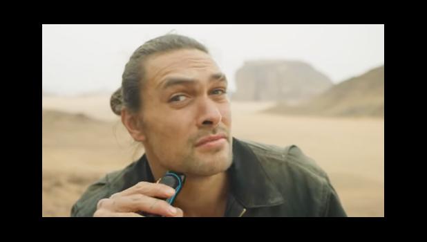 Jason Momoa shaving his beard.