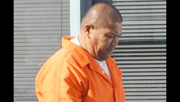 Former DPS officer Junior Utuga when he was first arrested in March of last year 