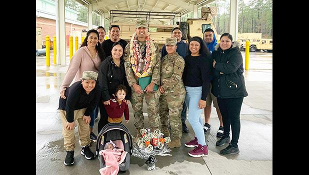 SSG Auelua with family after his promotion ceremony