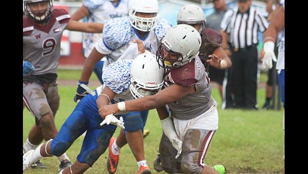 Marcus Samia hit hard by a Warrior defender
