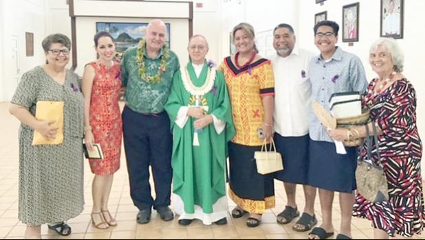 Karl Prendergast (third left) and Bishop Peter Brown (4th left) and other Holy Family parishioners
