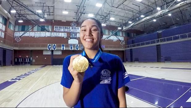 Heritage High School Timberwolves, junior Katie Peneueta with her gold medal.