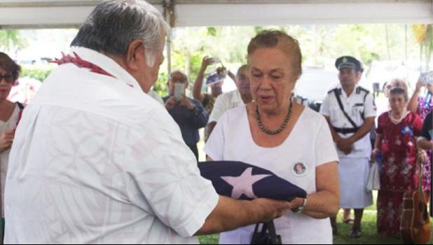 HONORING SERVICE TO SAMOA: Prime Minister Tuilaepa Dr. Sa'ilele Malielegaoi presents the flag of Samoa to Celine Keil during the funeral of Hans Joachim Keil at Lotopa. (Photo: Deidre Fanene) uilaepa Dr. Sa'ilele Malielegaoi presents the flag of Samoa to Celine Keil