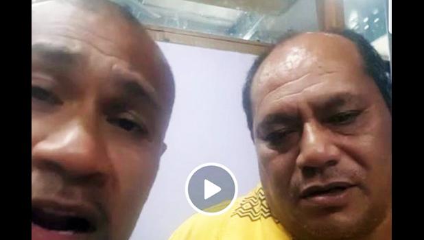 King Faipopo and a relative during a live broadcaast last night 
