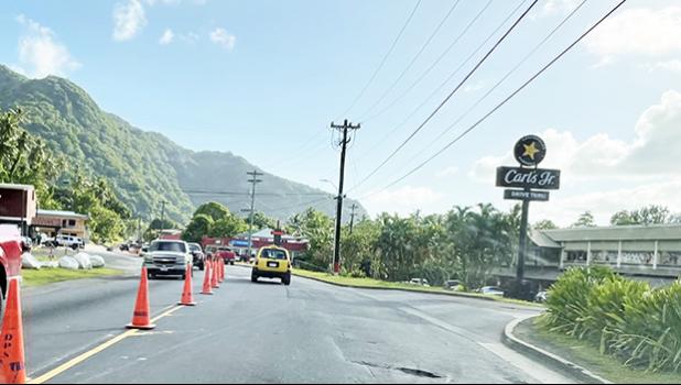 Traffic cones on road in from of CBT and Laufou