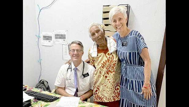 Missionaries, Dr. Eric Carter and nurse Allison Carter, visit with a patient in Manu'a Islands, American Samoa, 2023. Dr. Eric Carter and nurse Allison Carter with Manu'a patient