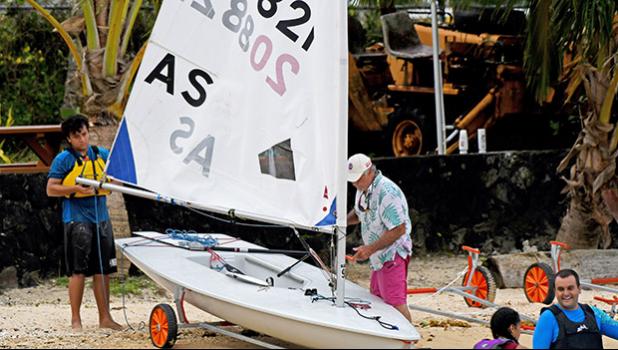 Leo Young and Jim McGuire securing Leo's Laser sailboat