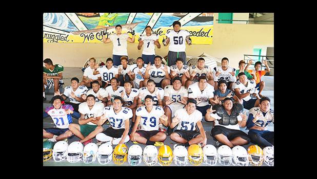 Lions Defensive unit for both Varsity and JV posing for a group photo. [photo: TG]