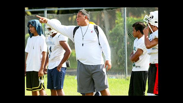 Leone Lions Head Coach, Okland Salave'a directing their strategic passing game during practice, at their school field this summer – in preparation for their game against the Vikes this Saturday. [photo: TG]