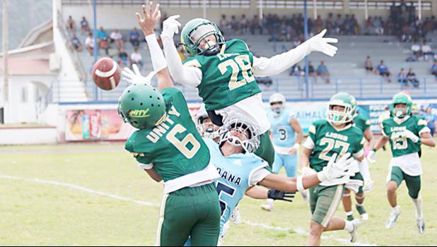 Two Leone Lions bat down the ball