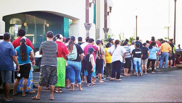 People standing in line to cash stimulus checks