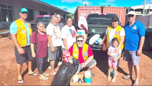 Lions Club of Pago Pago with fire victims and pulenu'u