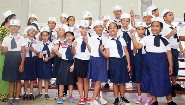 Manumalo Academy students dressesd up in sailor suits