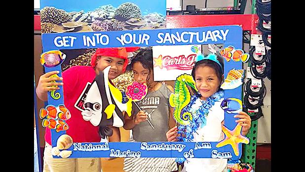 Three of the more than 300 kids and adults who took the virtual reality diving tour this past Saturday