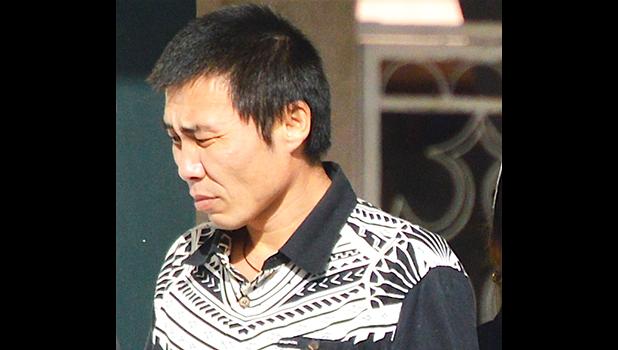 Tao Liu departing the court house after sentencing.  [photo: AF]