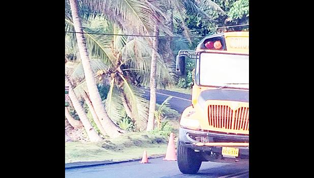 Low hanging telecom wires with bus driving under.