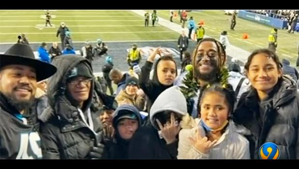 Frankie Luvu with his father (2nd left) and other family members after the Panthers win over the Seahawks on Dec. 11. [screen shot from WSOC-TV video. Frankie Luvu and family