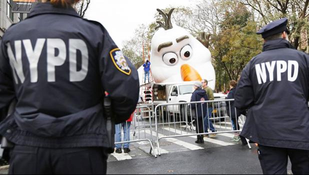 Police standing watch a day before the Thanksgiving Day parade