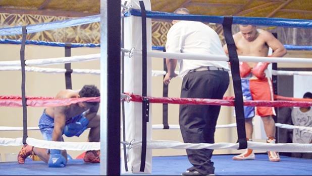 Tesimale Fatu-Taua’i of Samoa (left) when he was knocked down by Petelo Matagi (right) of American Samoa during the main event of the International Boxing Championship last weekend between the two Samoas, where American Samoa won all 5 amateur special bouts of the night. [photo AF]