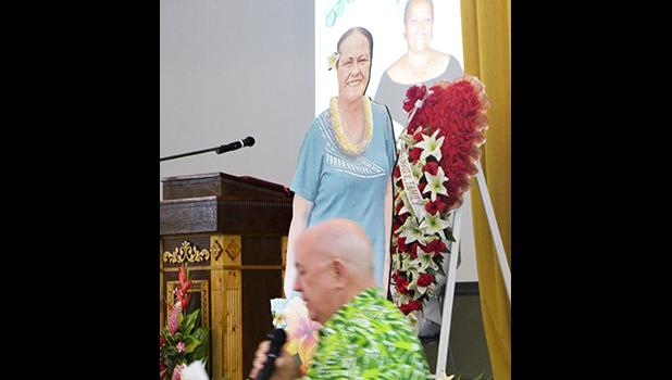  Territorial Bank of American Samoa (TBAS) president and chief executive officer David Muhler with photos of Makerita T. Polu in the background
