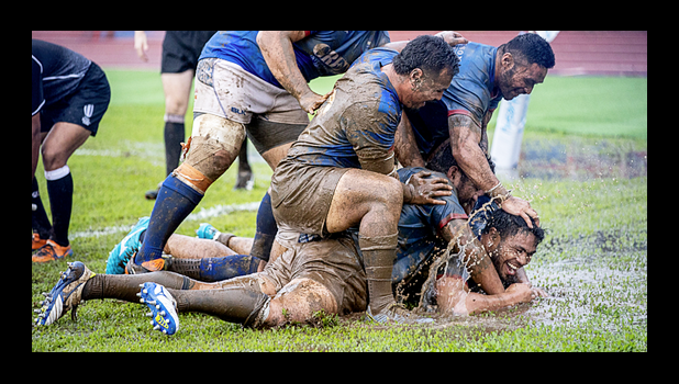 Muddy conditions on the field during Samoa vs Tonga rugby match