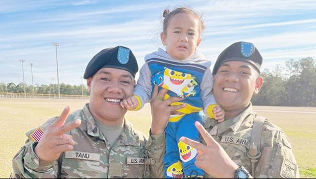PVT Fa’amagalo Tanu and PVT Sene Jr Isileli with their nephew Jelsen