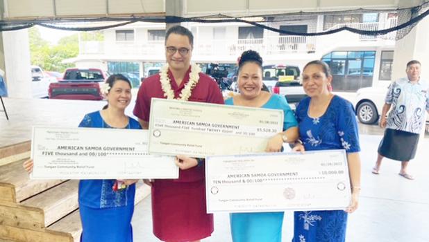 Manumalo presents checks for Tonga fundraising