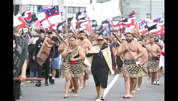 Indigenous Māori people walk through the streets of Wellington,