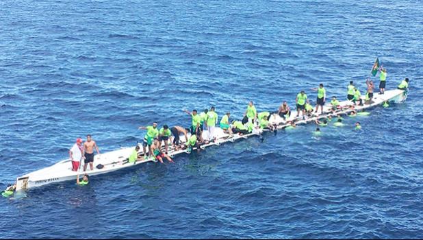 The Matasaua crew awaiting help to arrive after their fautasi took on water last Saturday