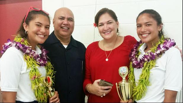 Proud parents Rev. Don and Hope Kruse with their twin daughters Jade and Jewel following the awards ceremony for the Territorial Math Competition last Friday. The girls competed in the Grade 8 Division with Jade coming in third place while twin sister Jewel took first place. [photo: Blue Chen-Fruean]
